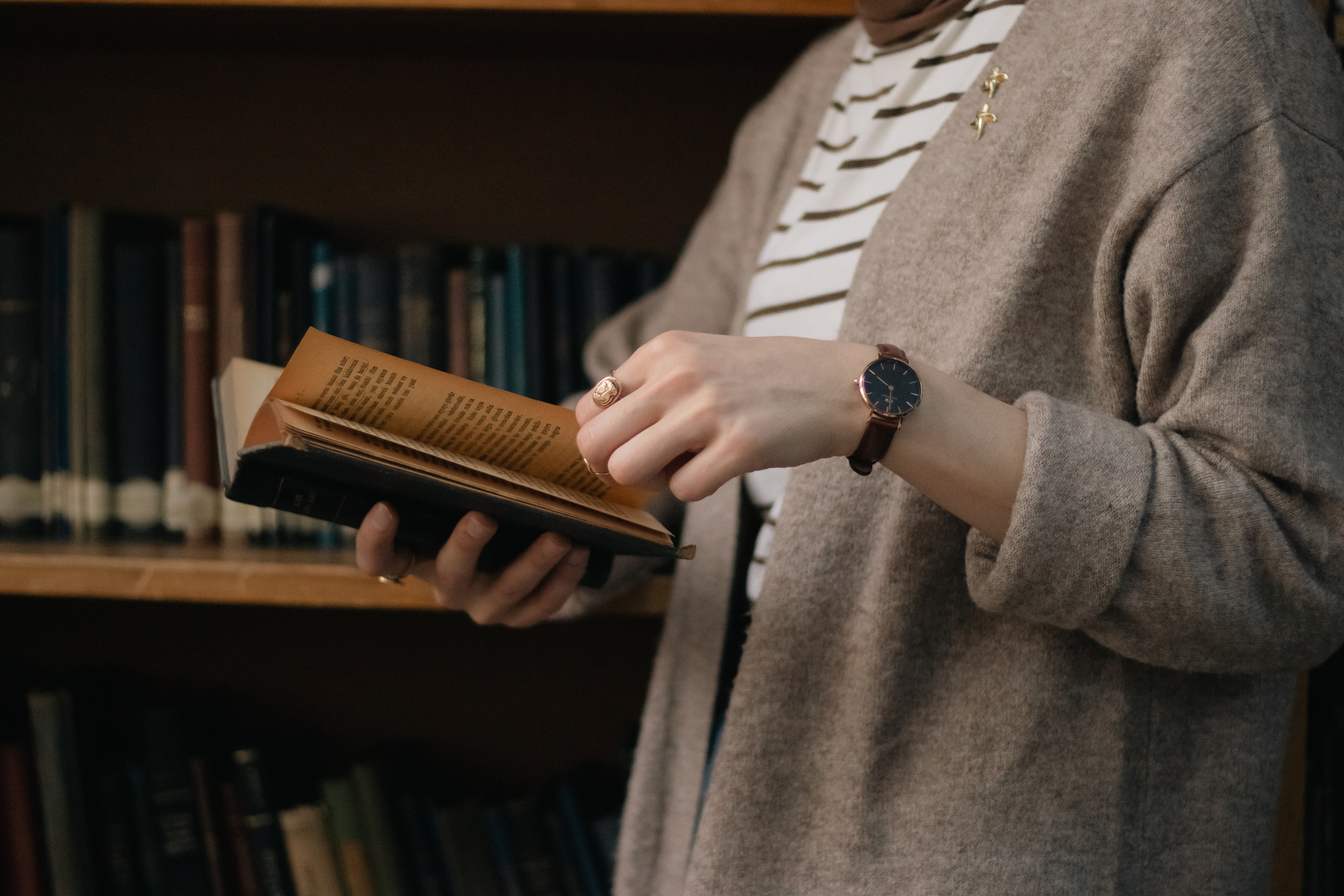 Student Reading Book in Library